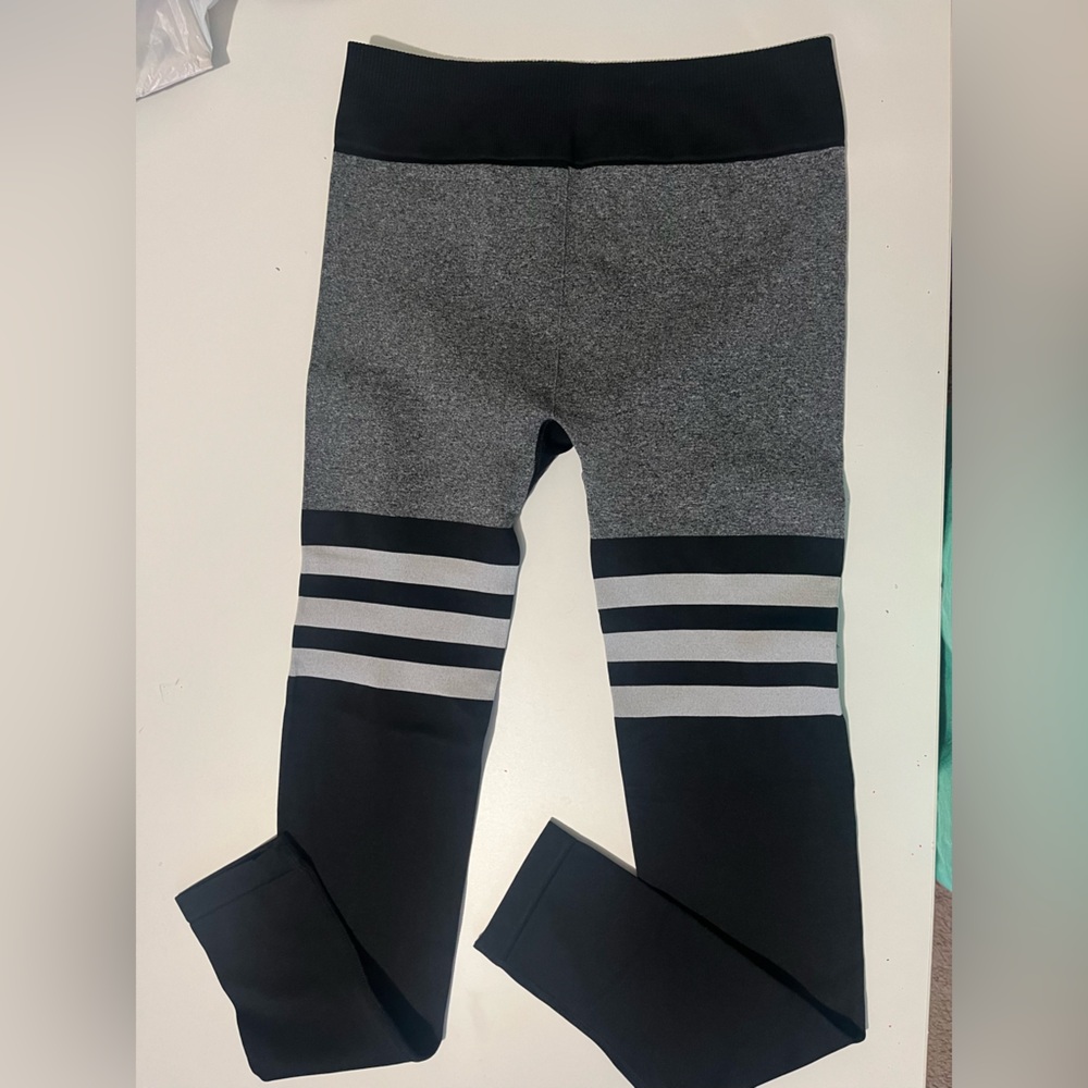 Medium, football print leggings, with tight waist reinforcement.